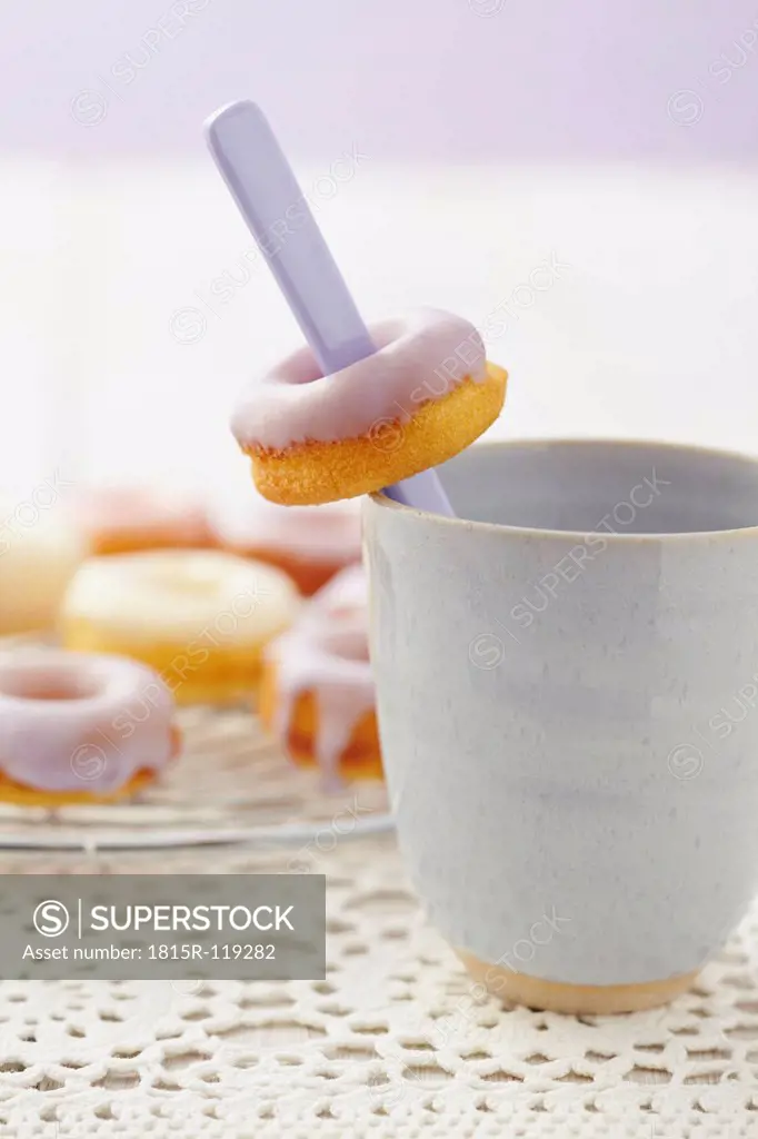 Glazed baked doughnuts on table