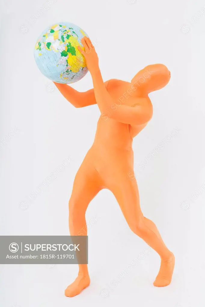 Mature man in orange zentai holding globe on white background
