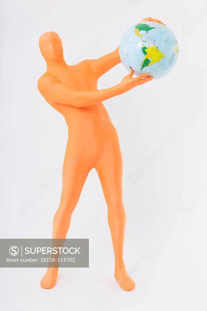 Mature man in orange zentai holding globe on white background