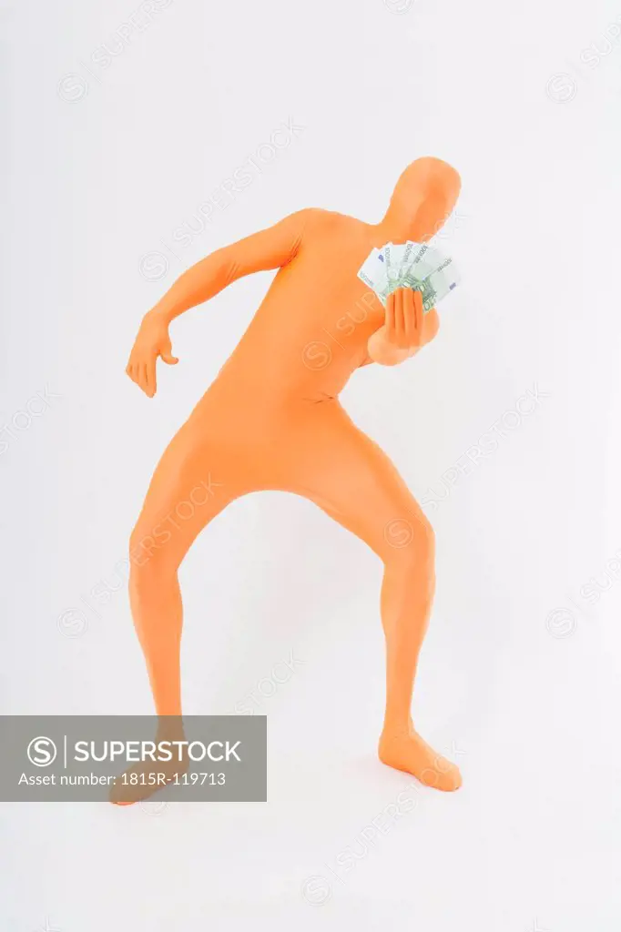 Mature man in orange zentai holding euro notes