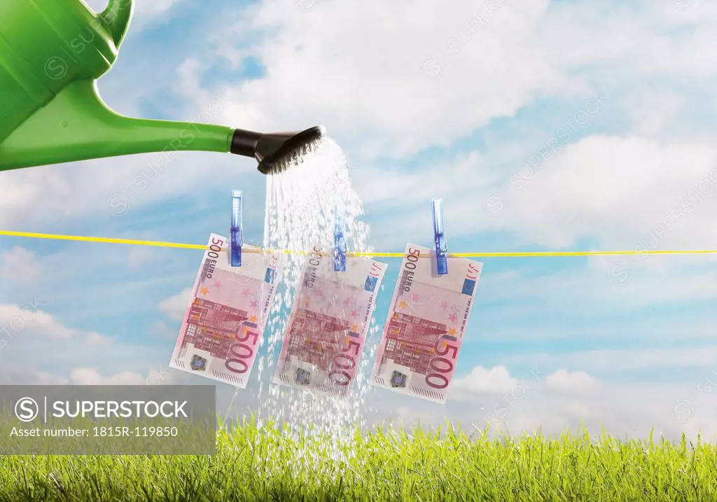 Germany, Watering five hundred euro note on clothing line
