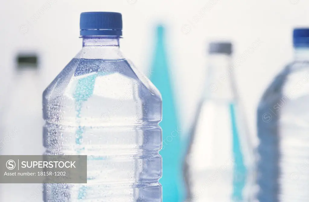 High section of bottled water, close up