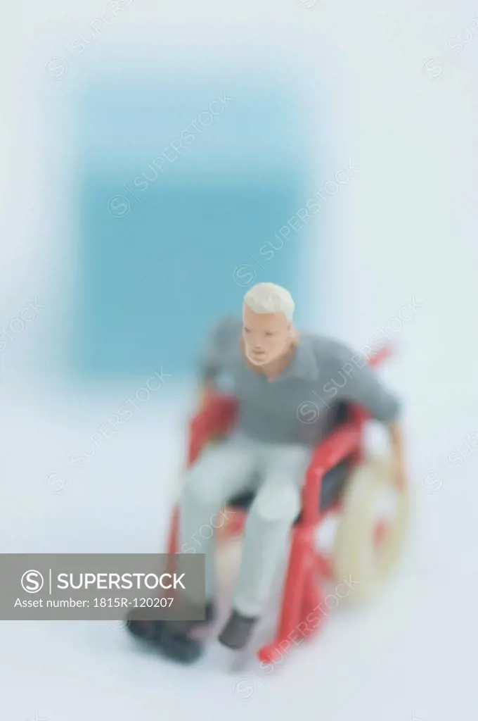 Figurine in wheelchair