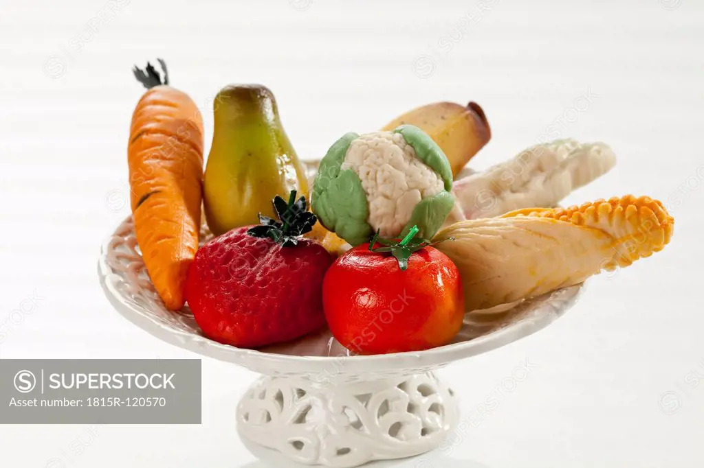 Marzipan as fruits and vegetables in fruit bowl, close up