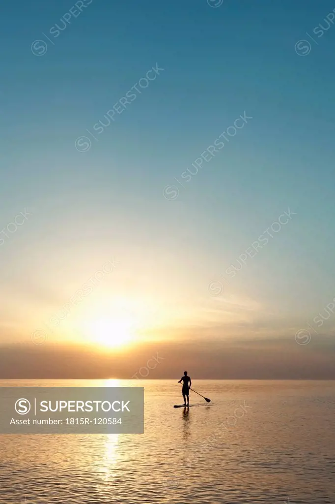 Germany, Schleswig Holstein, Man rowing on Baltic sea