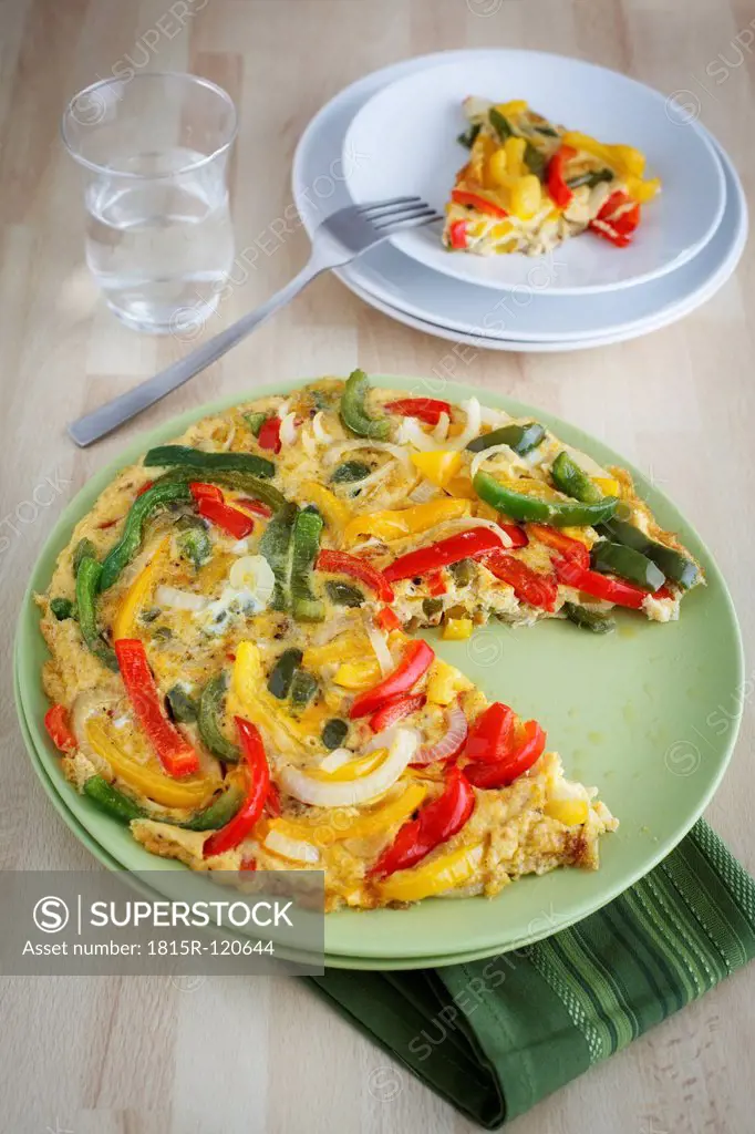 Plate of Spanish pepper omelette on table