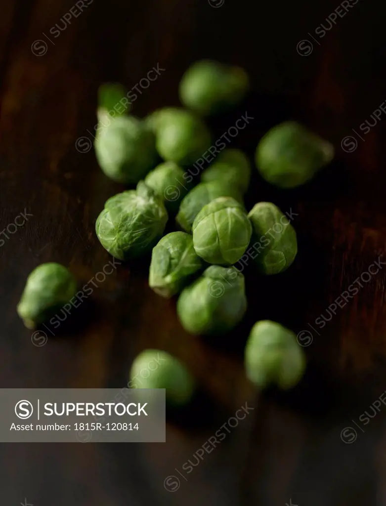 Brussels sprouts on wooden table, close up