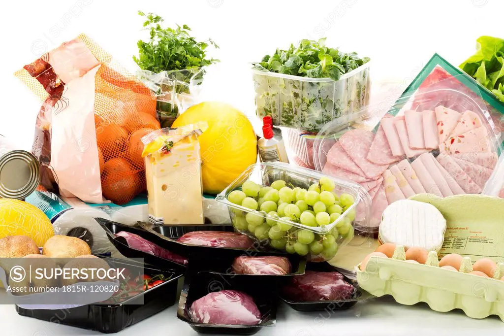 Various groceries on white background
