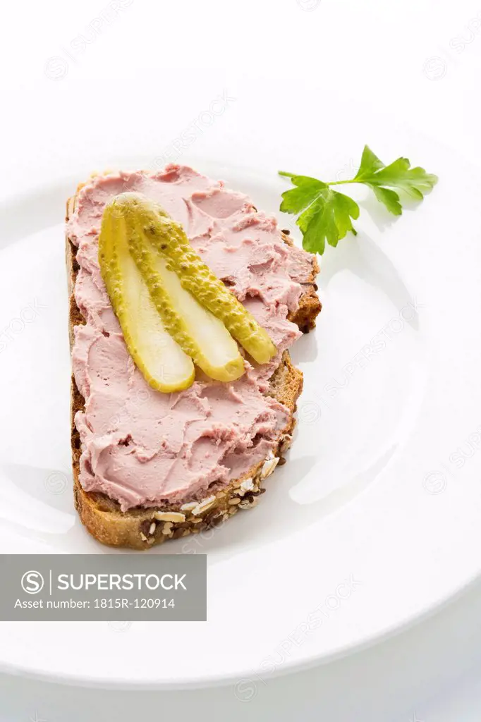 Liverwurst and pickle on whole grain bread, close up
