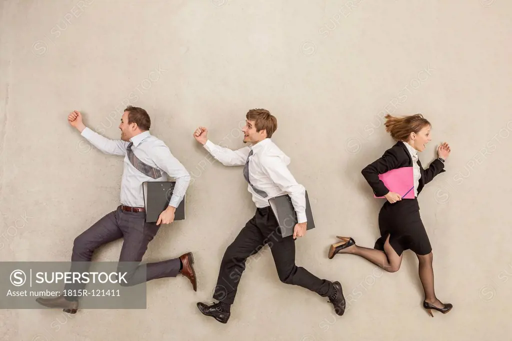 Business people running in opposite direction