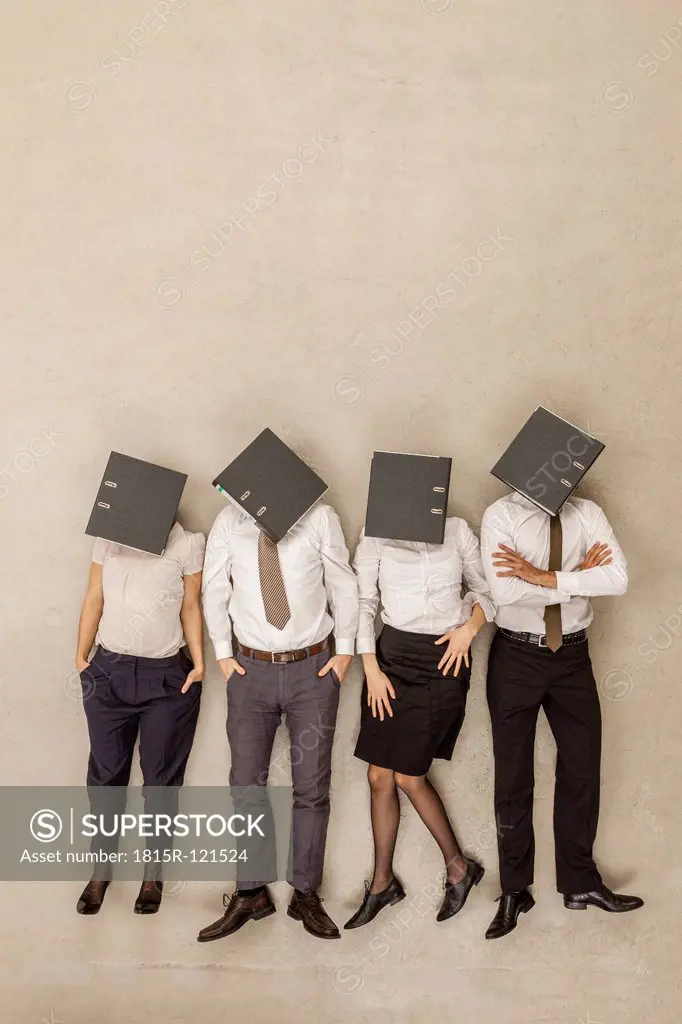 Business people with covered head by folders