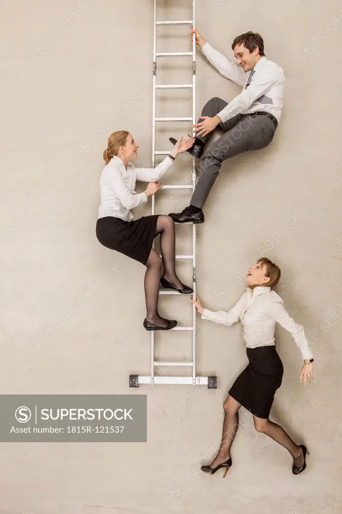 Business people climbing ladder