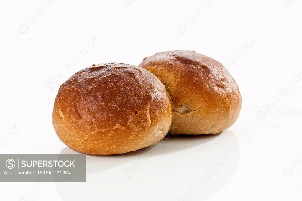 Rye bread rolls on white background, close up