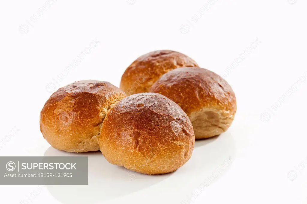 Rye bread rolls on white background, close up