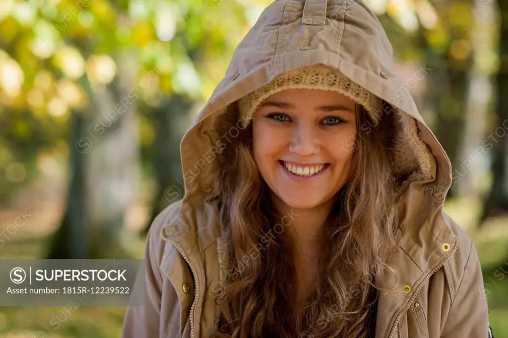 Germany, Rhineland-Palatinate, Female student wearing hood, smiling