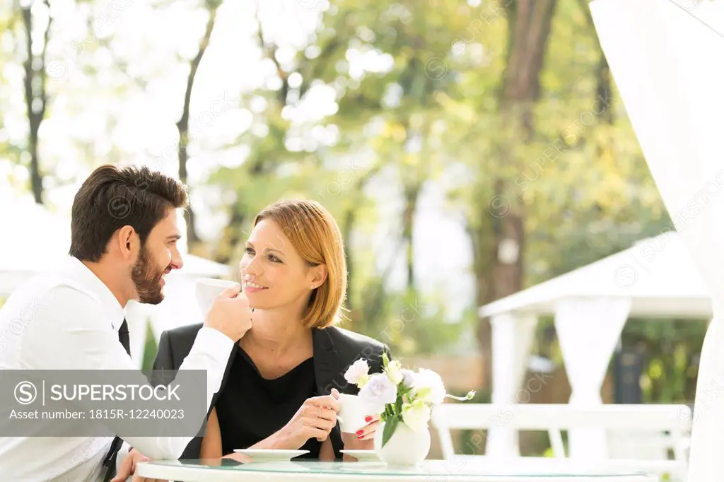 Smiling couple at outdoor cafe