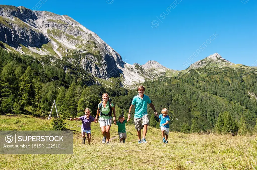 Austria, Salzburg, Family walking on mountains at Altenmarkt Zauchensee