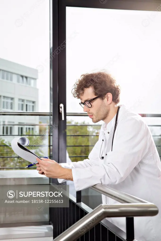 Germany, Berlin, Doctor checking documents