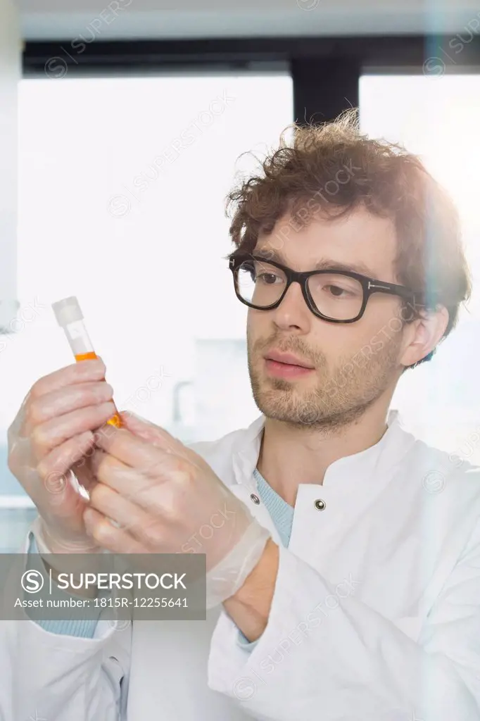 Scientist checking test tube