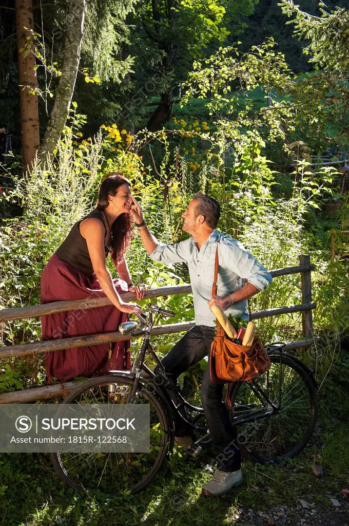 Austria, Salzburg Country, Mature couple in garden, smiling