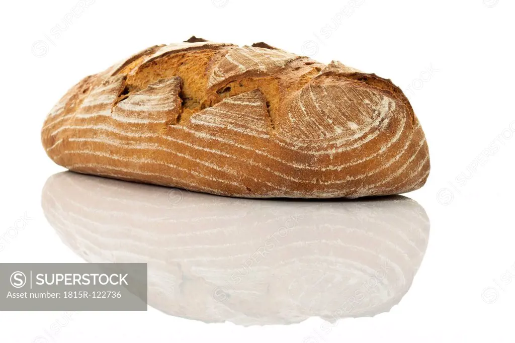 Loaf of bread on white background, close up