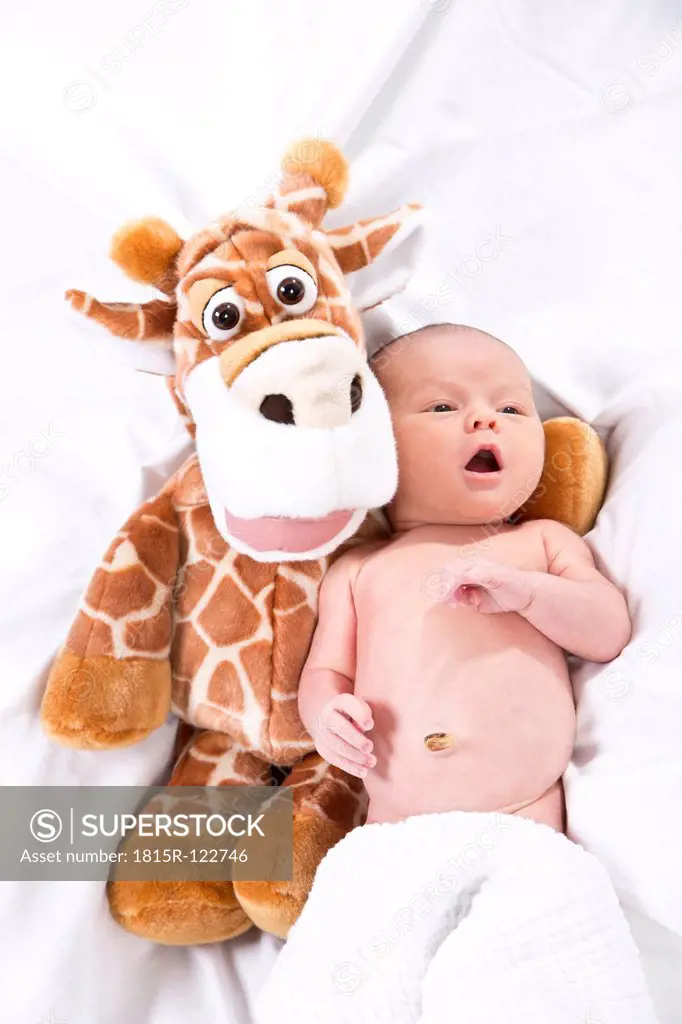 Baby with giraffe doll