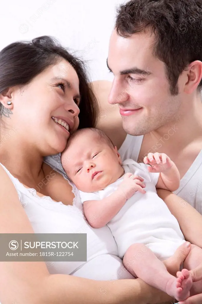 Parents with baby boy, smiling