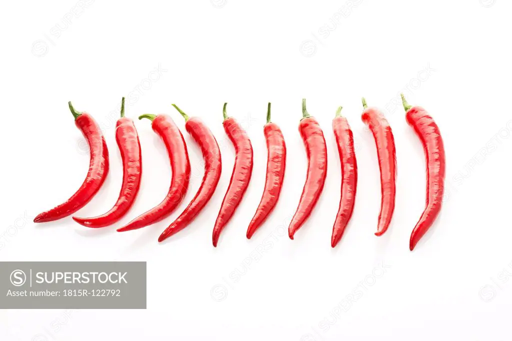 Red chilli peppers on white background, close up
