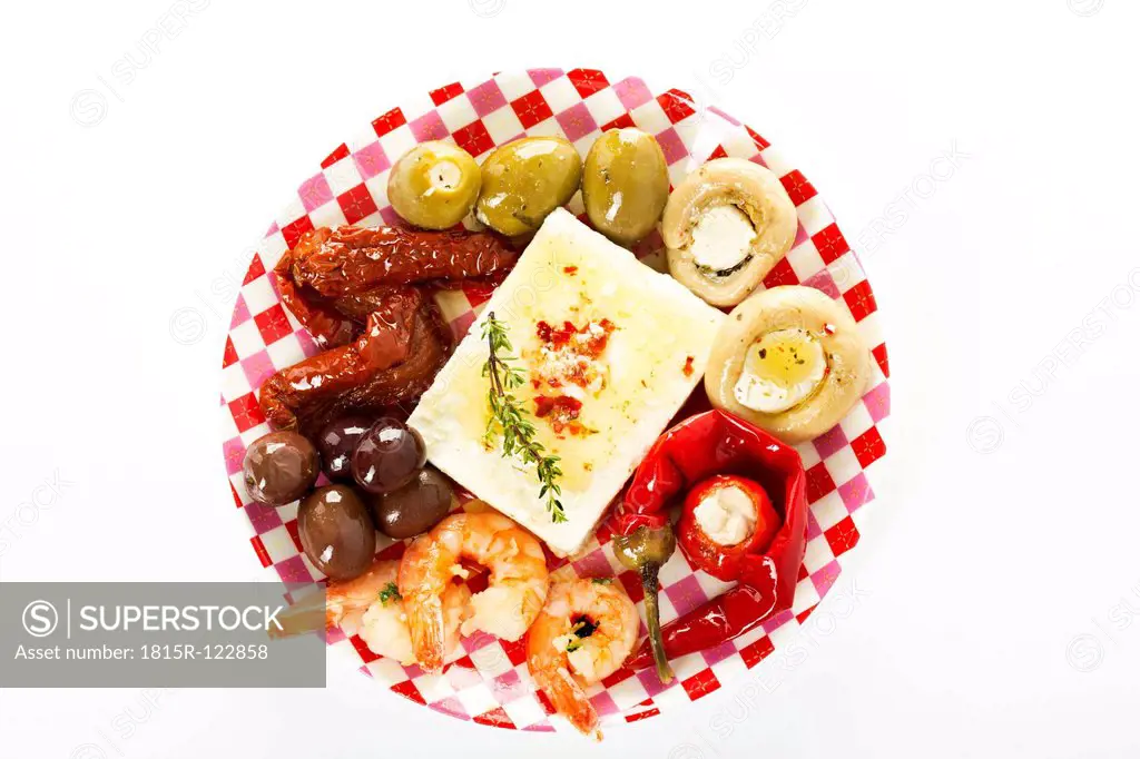 Various antipasti filled with cheese on plate, close up