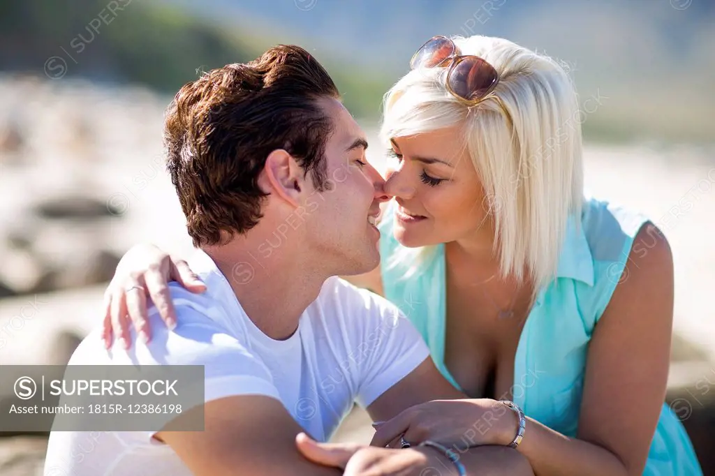 Young couple kissing on the beach