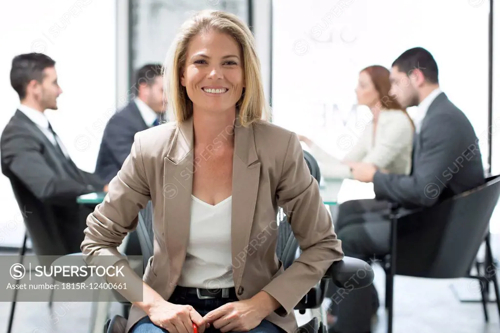 Portrait of confident businesswoman in boardroom