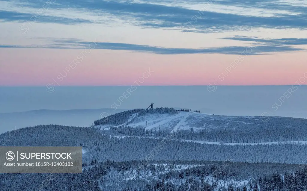Germany, Saxony-Anhalt, Harz National Park, Mountain Wurmberg with ski jump at sunset
