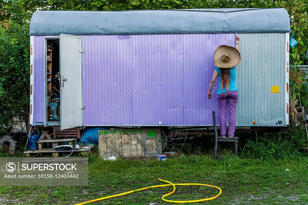 Woman standing at a trailer