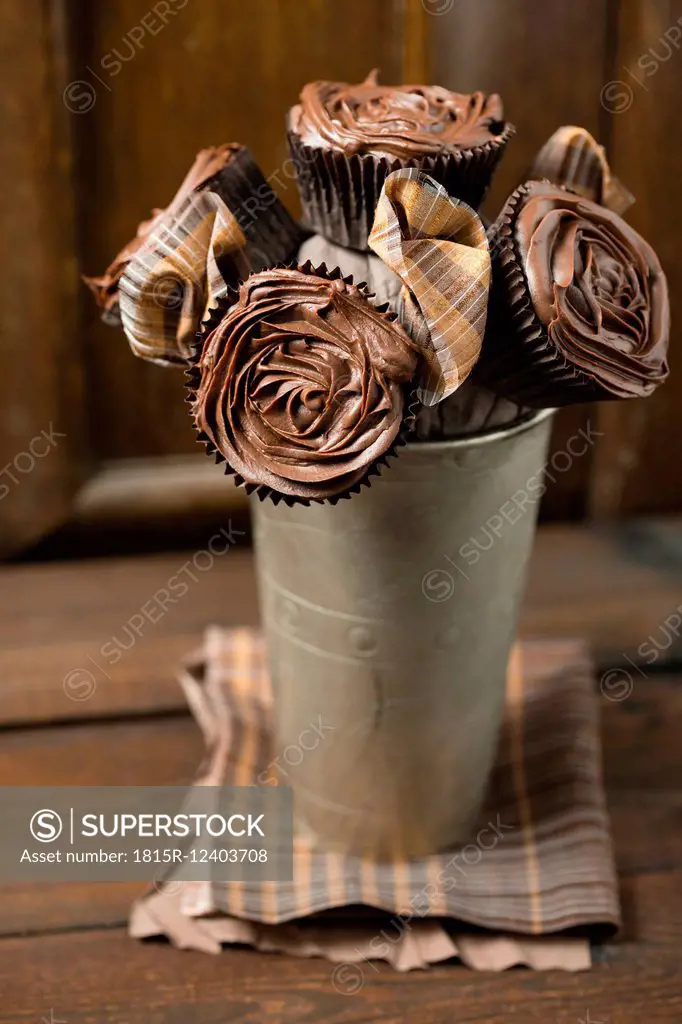 Bunch of cupcakes with chocolate roses made of ganache