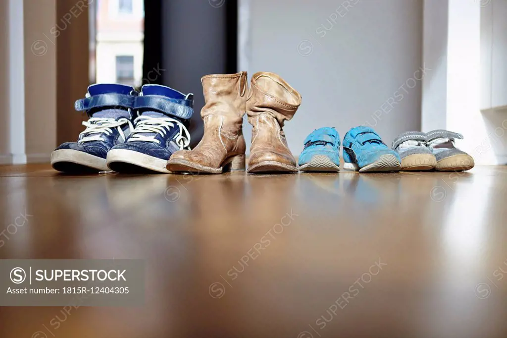 Row of shoes of a family