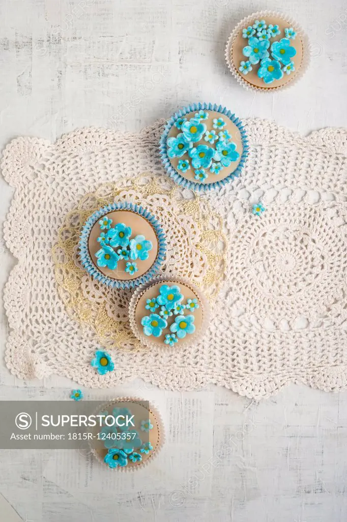 Cupcakes with blue forget-me-not blossoms