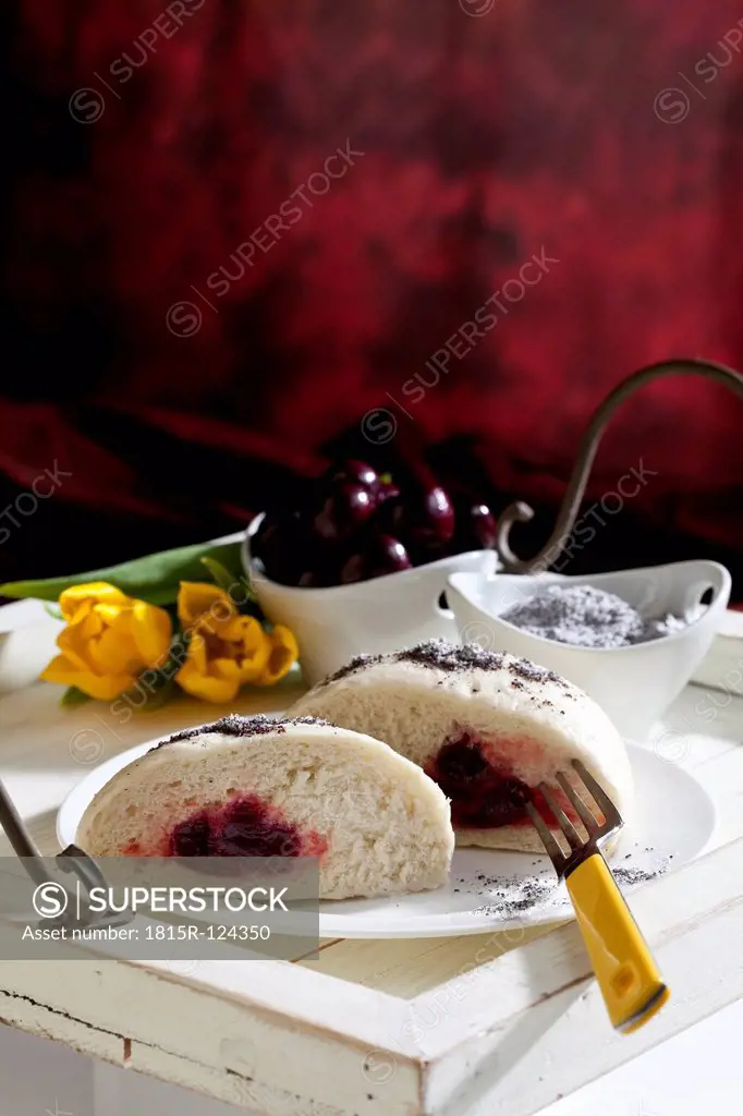 Yeast dumplings with cherry filling and poppy seed