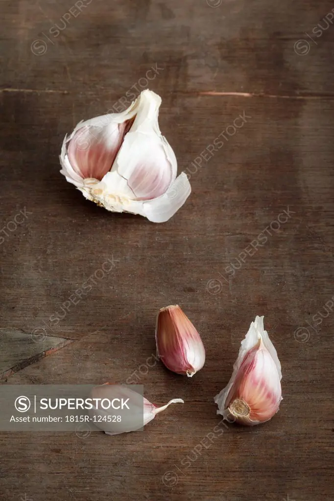 Garlic clove on wooden table, close up