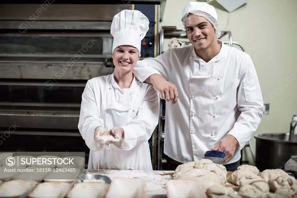 Portrait of two smiling bakers