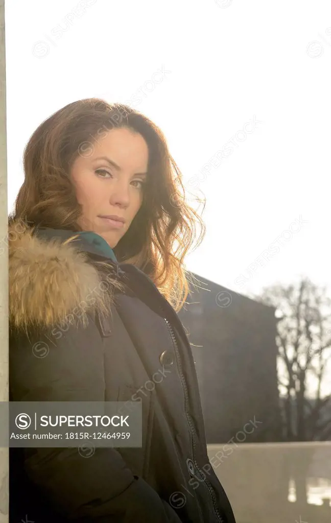 Portrait of brunette young woman in coat