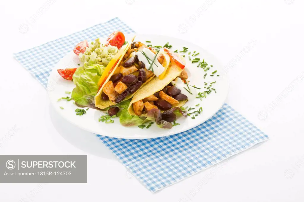 Tacos with chicken on plate, close up