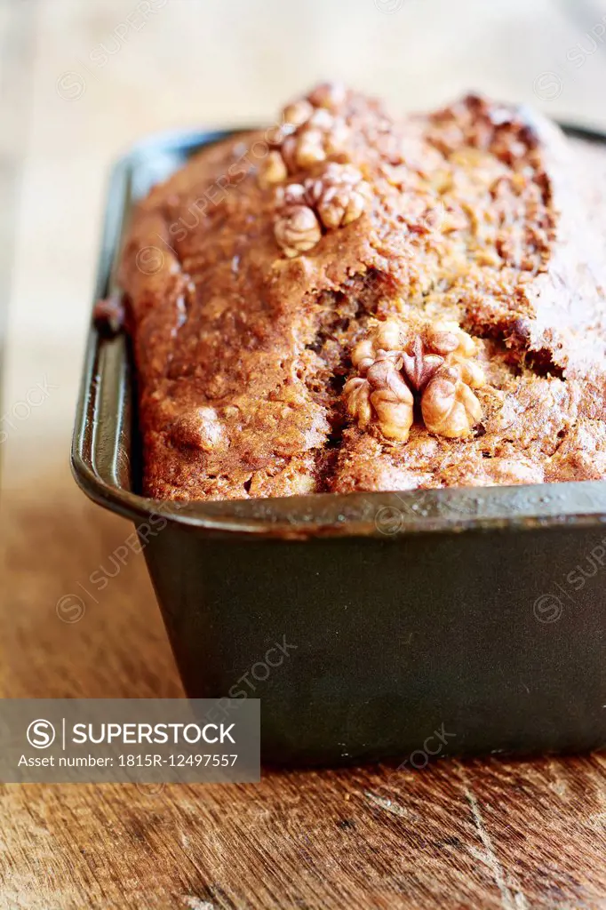 Banana bread with walnuts in a bread pan