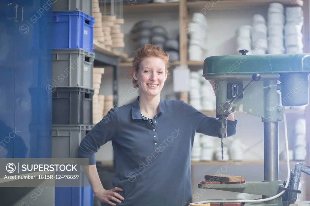 Portrait of confident young woman in workshop