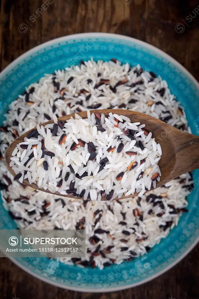 Organic basmati rice in bowl and on spoon