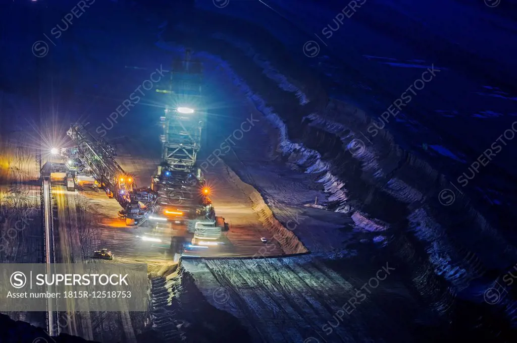 Germany, Juechen, Garzweiler, brown coal mining with lighted bucket-wheel excavator by night