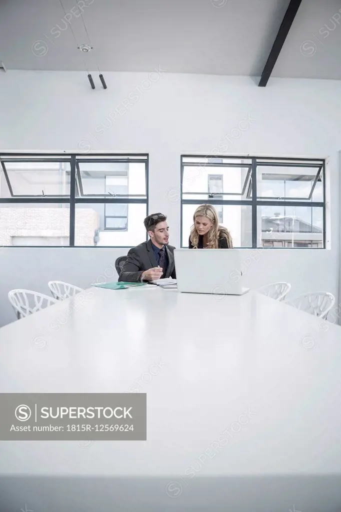 Businessman and businesswoman having an office meeting