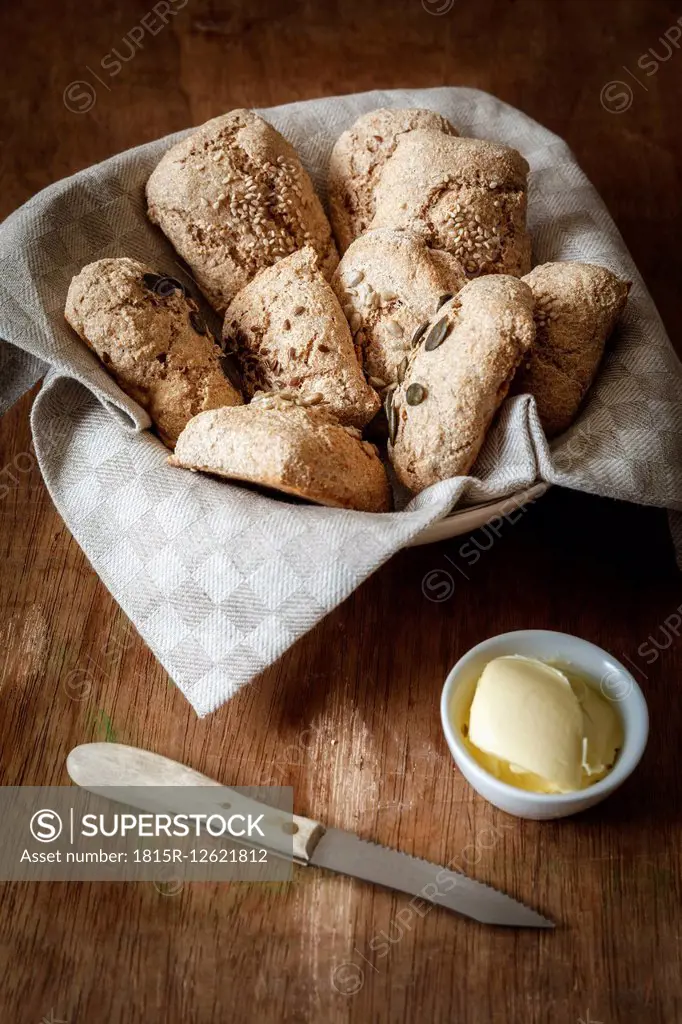 Bread basket of different home-baked whole meal spelt rolls