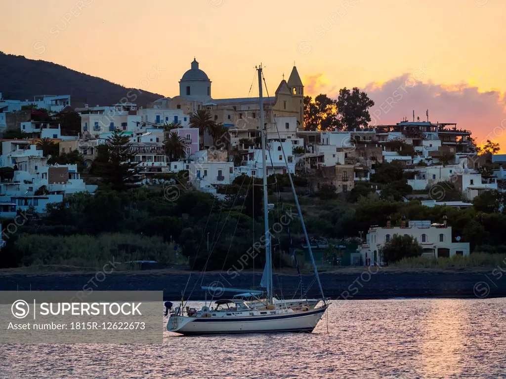 Italy, Sicily, Aeolian Islands, View to Isola Stromboli, Sailing boat at sunset