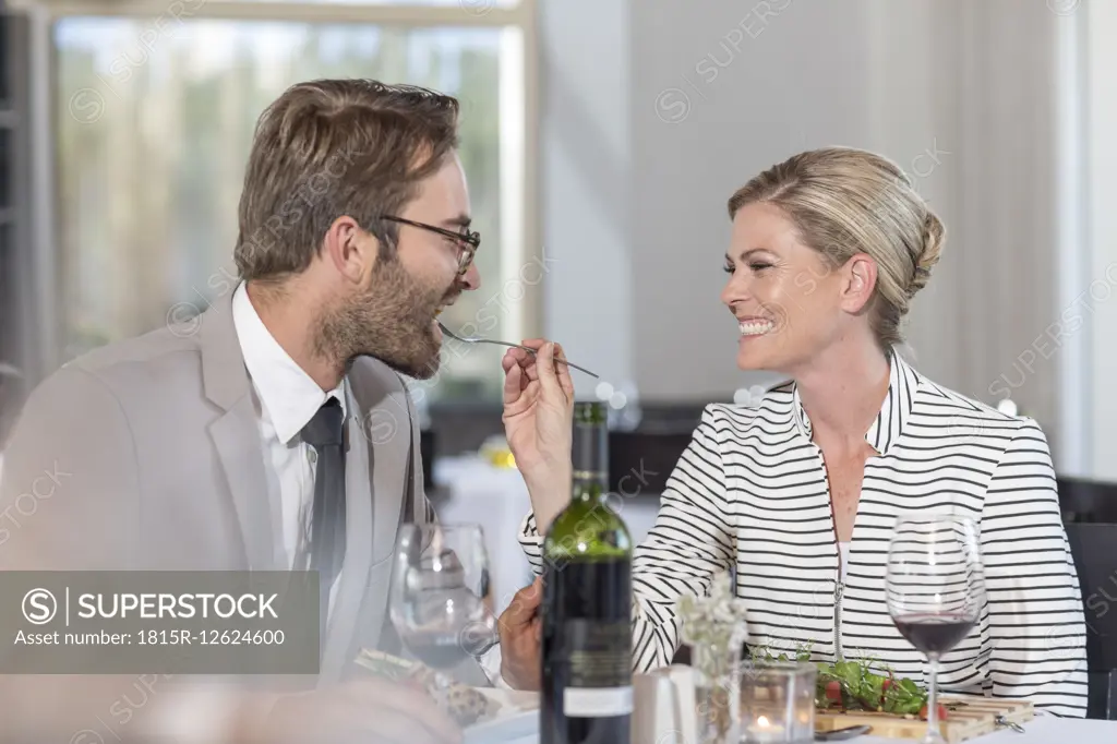 Happy couple having date in restaurant