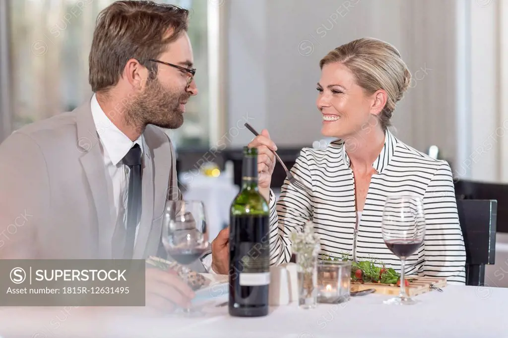 Happy couple having date in restaurant